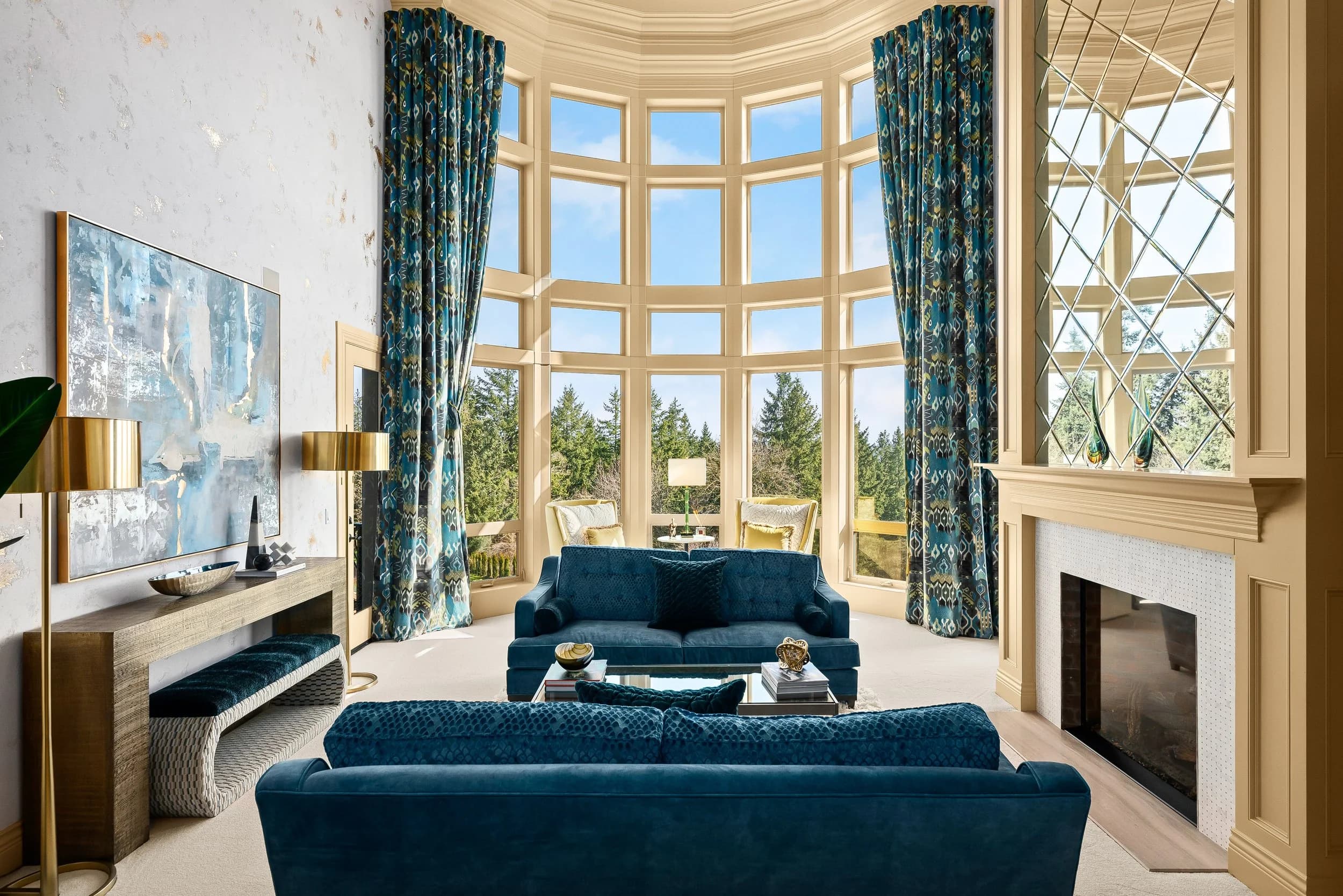 Two-story living room with tall curved windows